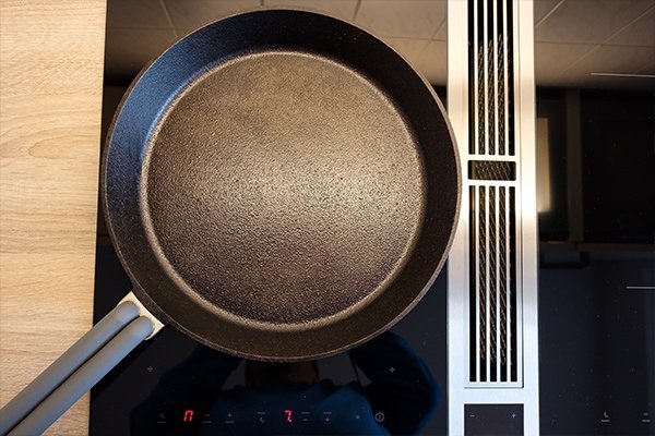 how to protect glass top stove from cast iron